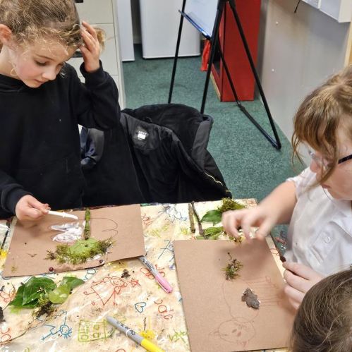 We went on a wet and windy walk around the field to collect some natural objects then we had fun creating pictures with the things we had found.